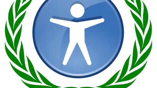 Laurel simbólico de accesibilidad web, referencia visual al debate sobre cumplimiento real de estándares WCAG frente al cumplimiento aparente que prometen los overlays de accesibilidad, productos que la comunidad de usuarios con discapacidad y los organismos reguladores europeos rechazan con creciente claridad
